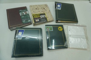 5 unopened photo albums with extra pages