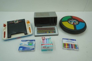 vintage electronic games including Simon, Tomy Lights Alive, Talking Computron and chalk