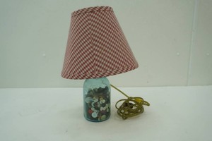 vintage Ball jar repurposed to a lamp filled with vintage buttons