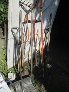 Variety of shovels, pitch fork, pos...