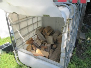 Metal caged plastic holding tank co...
