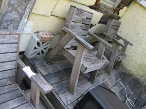 Trio of wooden slat patio chairs...