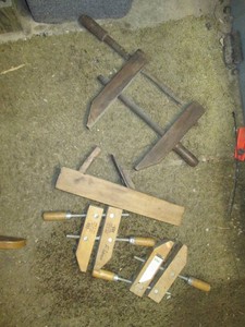 Variety of clamps and vintage manua...