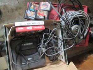Sega Genesis game console with cont...