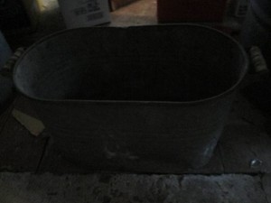 Oblong metal wash basin with wood h...