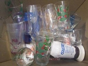 Various styles of glass drinkware c...