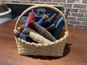 Vintage Woven Sewing Basket with Assorted Wooden Textile Spools