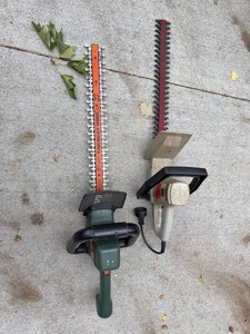 Pair of Craftsman and Black & Decker Electric Hedge Trimmers