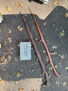 Vintage fishing spears with Metal Life Raft First Aid Kit Box