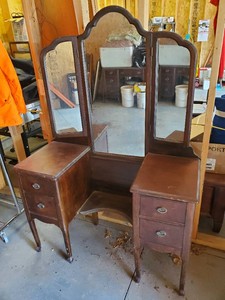 Antique 1920s Vanity features a unique trifold mirror