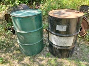 2 Metal Barrels Both Empty 1 Has an open top