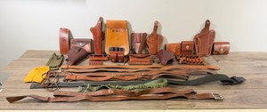 Large Lot of Pistol Holsters, Rifle Straps, Ammunition Holders and More