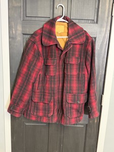 Vintage  Woolrich Mackinaw red and black plaid wool hunting field jacket with multiple front pockets and a large collar