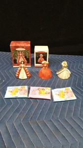 1993, 1994, and 1997 Hallmark Keepsake Barbie ornaments and 3 Barbie tissue packs