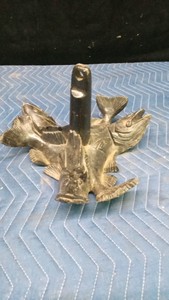Boat anchor with decorative fish on it