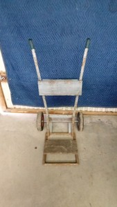 Two-wheeled dolly with larger lifting plate