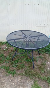 Metal patio table with umbrella hole