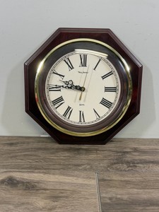Vintage-style New Haven Quartz Wall Clock featuring an octagon-shaped wood frame with a cherry or mahogany finish, an off-white dial, a polished brass-finished bezel, and traditional Roman numerals