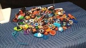 Lot of Beyblades and parts including energy layers, forge discs,performance drivers and launchers