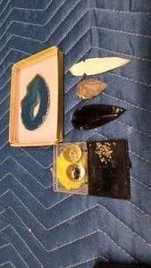 3 arrow heads, blue agate slab, marbles, and tiny pieces that looks like it could be gold.