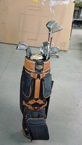 Golf bag of golf clubs, balls and wood tees