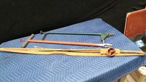 Weed pulling tool, ground probe, and 2 bows (1 with pull back arrow)