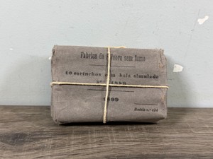 Vintage Portuguese 8mm M89 Kropatschek ammunition packet (specifically containing 10 cartridges, often with wooden or simulatedblank bullets) wrapped in heavy grey paper and tied with string, dating from the late 19th or early 20th century