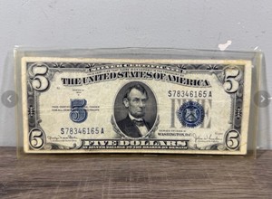 1934-D $5 Silver Certificate with a blue Treasury seal and the portrait of Abraham Lincoln in a Plastic protective sleeve