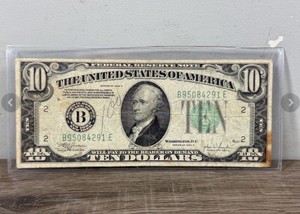 1934 C ten-dollar Federal Reserve Note featuring a portrait of Alexander Hamilton in plastic protective sleeve