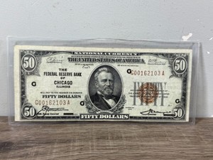 Series of 1929 $50 Federal Reserve Bank Note issued by the Federal Reserve Bank of Chicago, Illinois, featuring the portrait of President Ulysses S. Grant on the front and a redbrown Treasury seal with a low serial number (G00162103A).