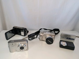 Lot of various cameras - HP Photosmart M525 compact digital camera, Toshiba Camileo H30 high-definition digital camcorder, vintage Olympus Camedia C-770 Ultra Zoom digital camera- untested