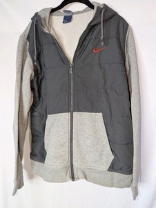 Nike jacket,  grey fleece body and sleeves contrasted with a dark grey padded center panel, size Large