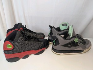 2 Pairs of Nikes 5.5Y,  Nike Air Jordan 13 Retro Bred and Nike Air Jordan 4 Retro Green Glow sneakers