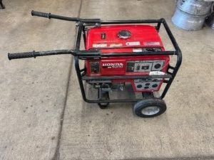 Honda EB5000 Portable Gas Generator. Pulls over. Old gas. Used one time after storm.