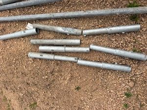 Eight Galvanized Steel Flag Pole Holders, utilizing vertical dock post