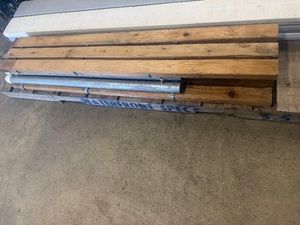 Seven Cedar 8 Long Dock Bumper Boards, on 4 6 Long Galv 2 Pipe, with 3- 2 x 4 Steel Bumper Board Brackets, with White Safety Caps