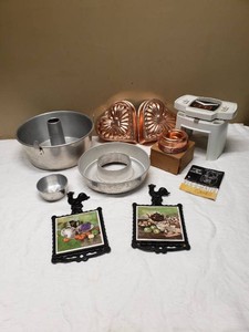 Various Kitchenware Items Including Veg-O-Matic, Baking Molds, Trivet