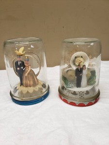 Vintage Wedding Cake Topper Display in Glass Jars, Bride and Groom Figurines with Floral Accents