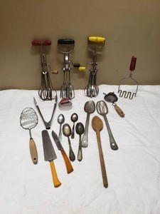 Kitchen Utensils and Tools Lot including Egg Beaters, Spoons, Knives, and Mashers