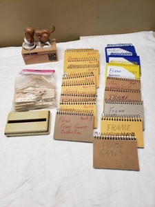 Bag of Wooden Clothespins, Dog Coin Bank, and Assorted Frame Game Notebooks