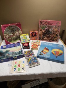 Puzzle Collection including Thomas Kinkade and Magna Puzzles, Dorset Round Jigsaw, Grand Master Series, and Childrens Puzzles