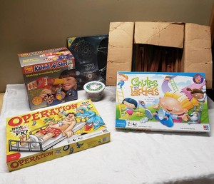 Collection of Vintage and Modern Board Games and Toys including Operation, Chutes and Ladders, and Kaleid-A-Sketch