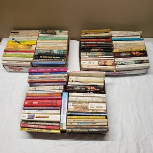 Assortment of Books Titles include Journey Into Joy, Shadow of a Lady, The Great Escape, and The Mosquito Coast. Books seem to range from historical to contemporary themes.