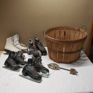 Assorted Vintage Ice Skates and Roller Skates with Wooden Basket