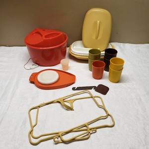 Tupperware Kitchenware Set including Yellow Container, Orange Circular Cutter, Assorted Cups, and Salad Spinner