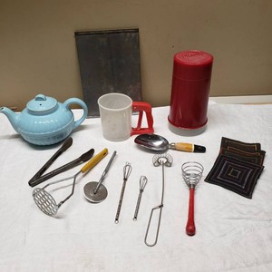 Kitchenware Items including Blue Teapot, Red Thermos, and Kitchen Utensils