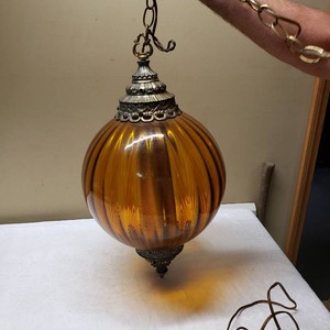 Amber Glass Hanging Light Fixture with Ornate Metal Detailing
