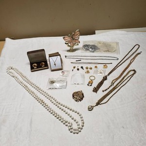 Assorted Jewelry with Avon Cufflinks and Cross Necklace, Various Pins, Chains, and Brooches
