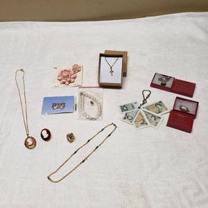 Mixed Jewelry and Collectible Items Including Cameo Lockets, Pearl Necklace, and Pewter Miniatures