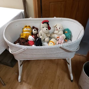 White Wicker Baby Bassinet with Stuffed Animals